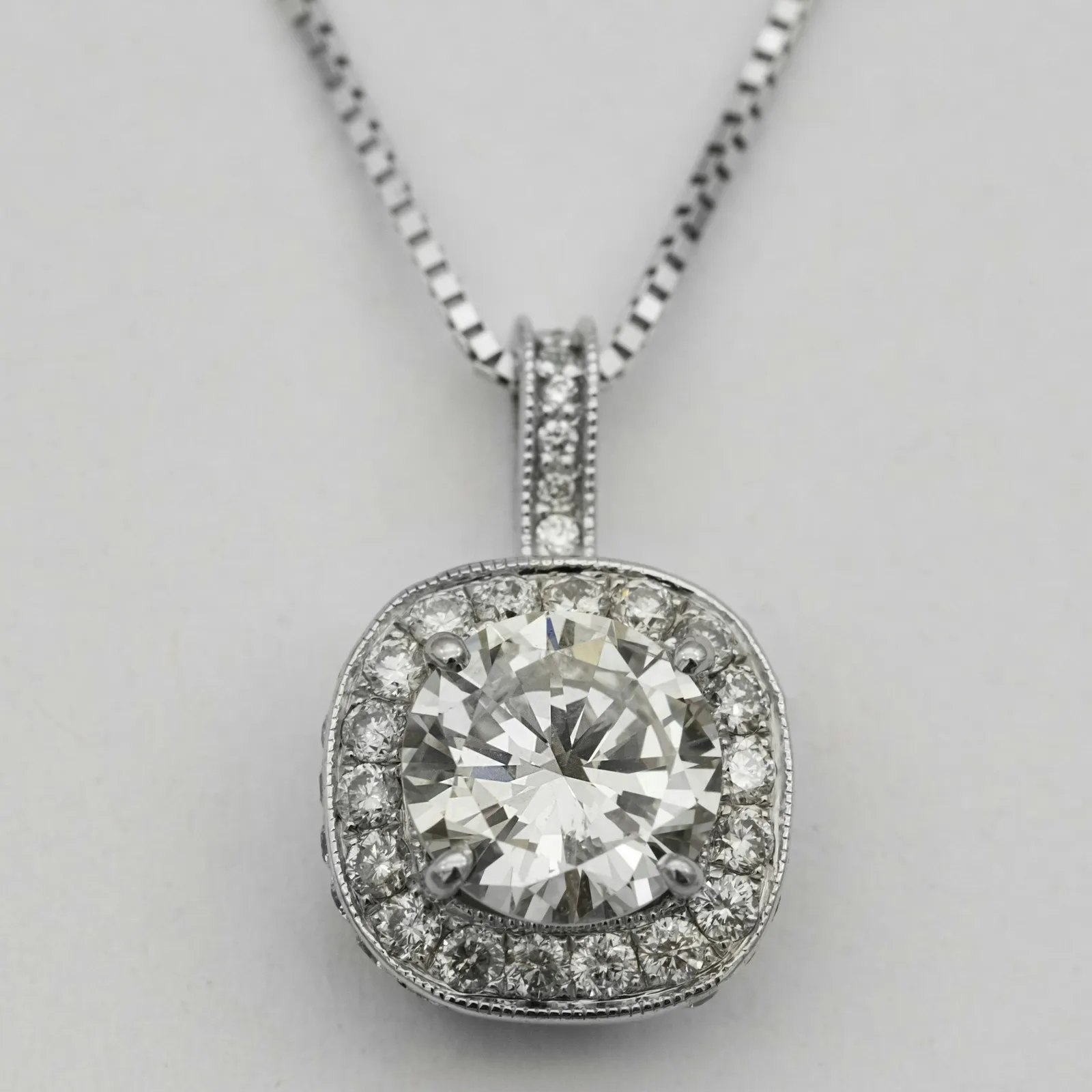 Original photo of a diamond solitaire halo pendant